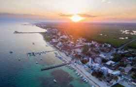 Puerto Morelos, Mexico. Travel Advisory. - Sunset over town