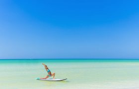 Yoga Training on a Paddleboard at the beach in Holbox